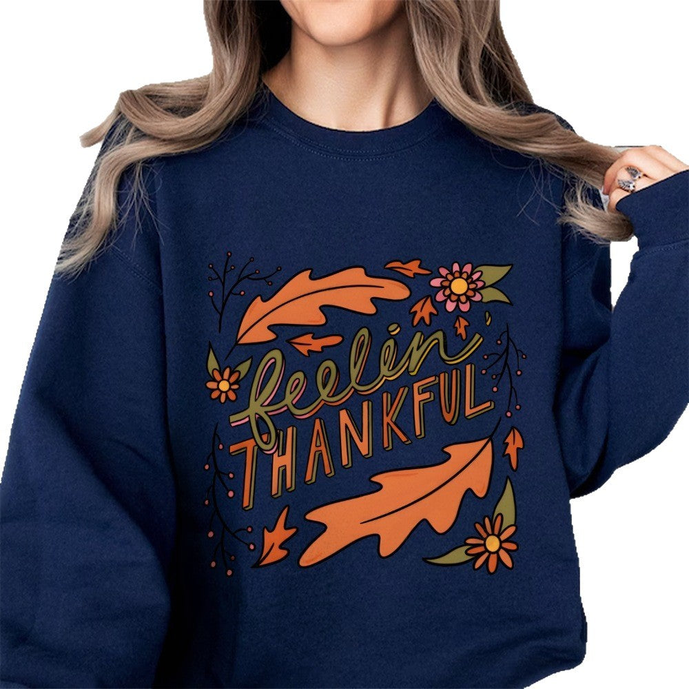 Kvinnors sweatshirt med färgglad höstmotiv och inspirerande text Mirla-Eva Jonsson