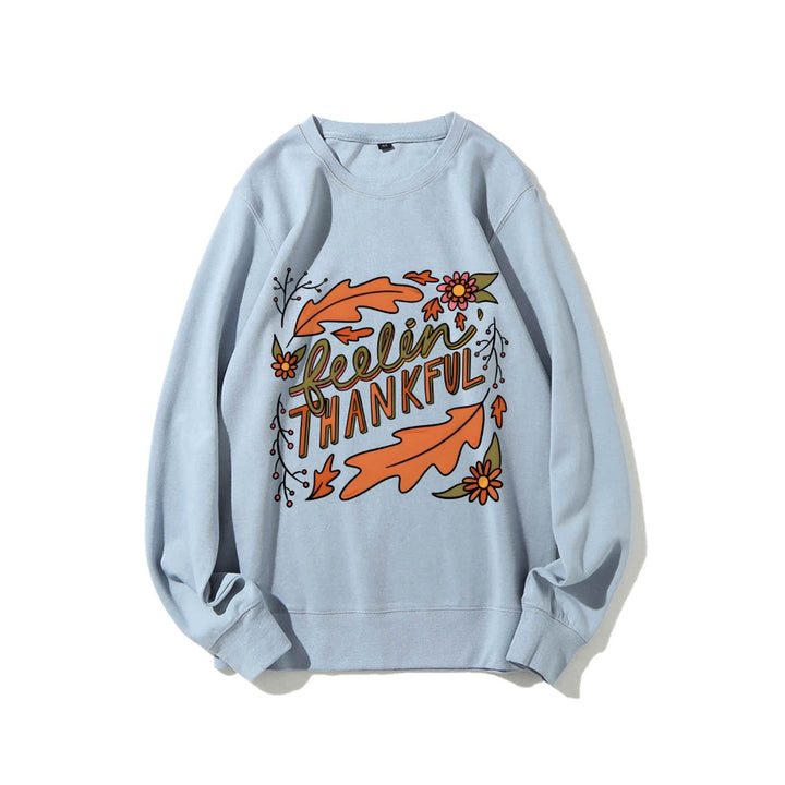 Kvinnors sweatshirt med färgglad höstmotiv och inspirerande text Mirla-Eva Jonsson