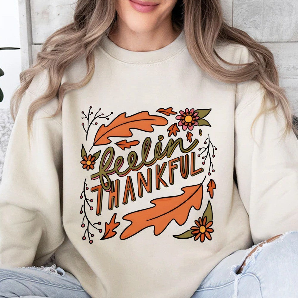 Kvinnors sweatshirt med färgglad höstmotiv och inspirerande text Mirla-Eva Jonsson