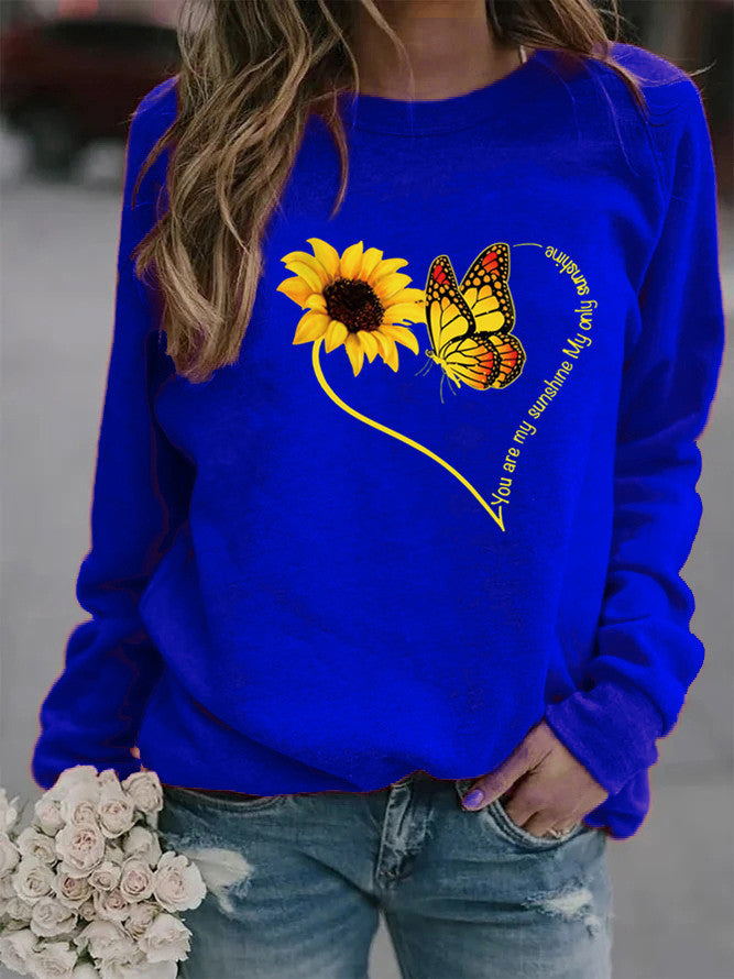 Kvinnors sweatshirt med grafisk fjäril och solrosmotiv Mirla-Eva Jonsson