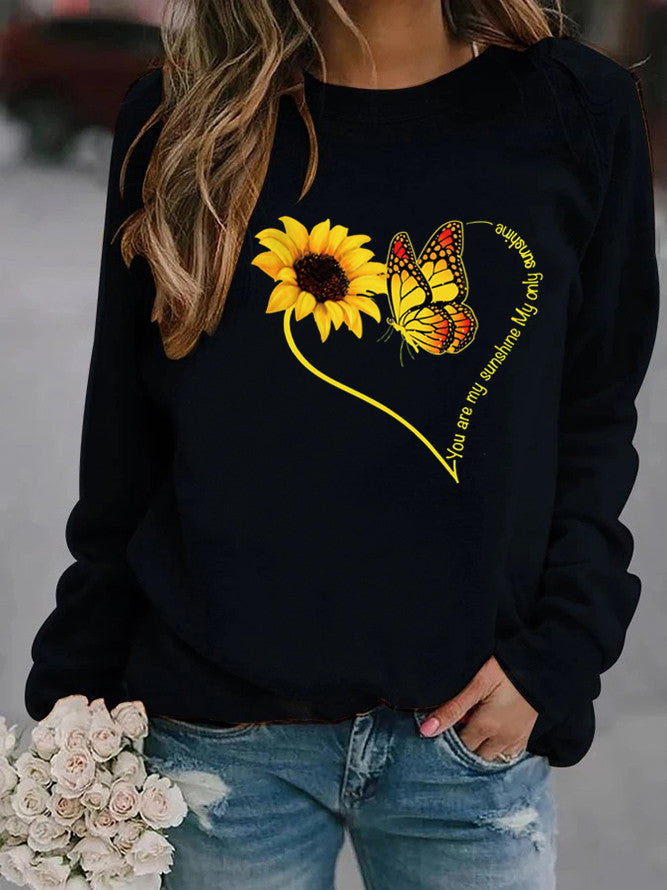 Kvinnors sweatshirt med grafisk fjäril och solrosmotiv Mirla-Eva Jonsson