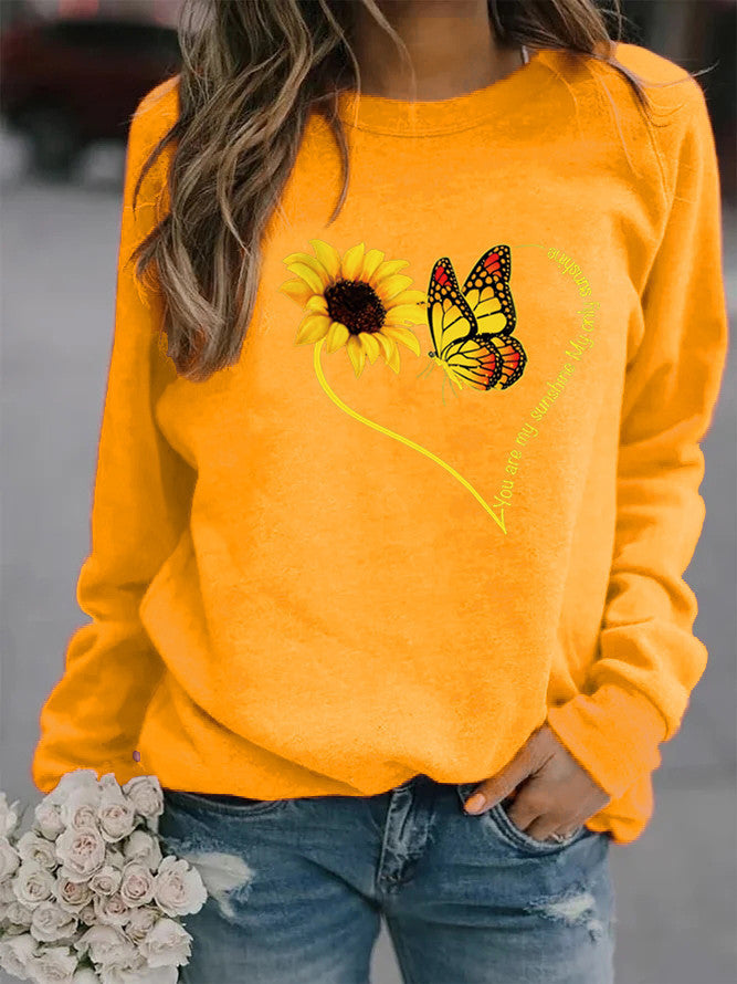 Kvinnors sweatshirt med grafisk fjäril och solrosmotiv Mirla-Eva Jonsson