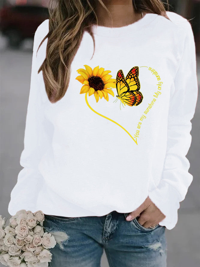 Kvinnors sweatshirt med grafisk fjäril och solrosmotiv Mirla-Eva Jonsson
