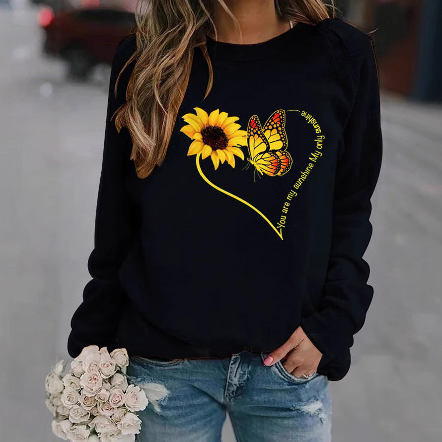 Kvinnors sweatshirt med grafisk fjäril och solrosmotiv Mirla-Eva Jonsson