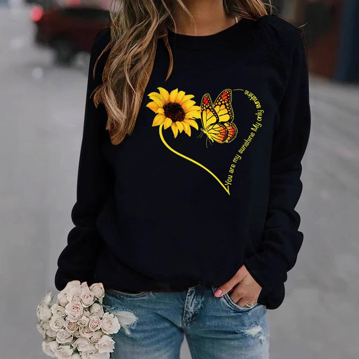 Kvinnors sweatshirt med grafisk fjäril och solrosmotiv Mirla-Eva Jonsson