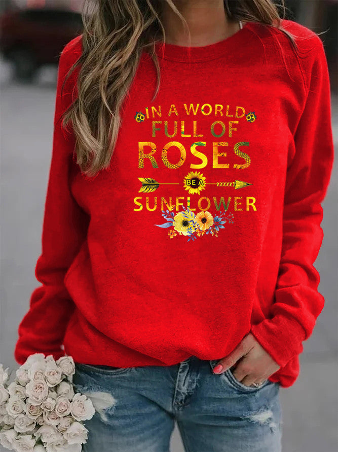 Kvinnors sweatshirt med inspirerande design och blommig dekorering Mirla-Eva Jonsson