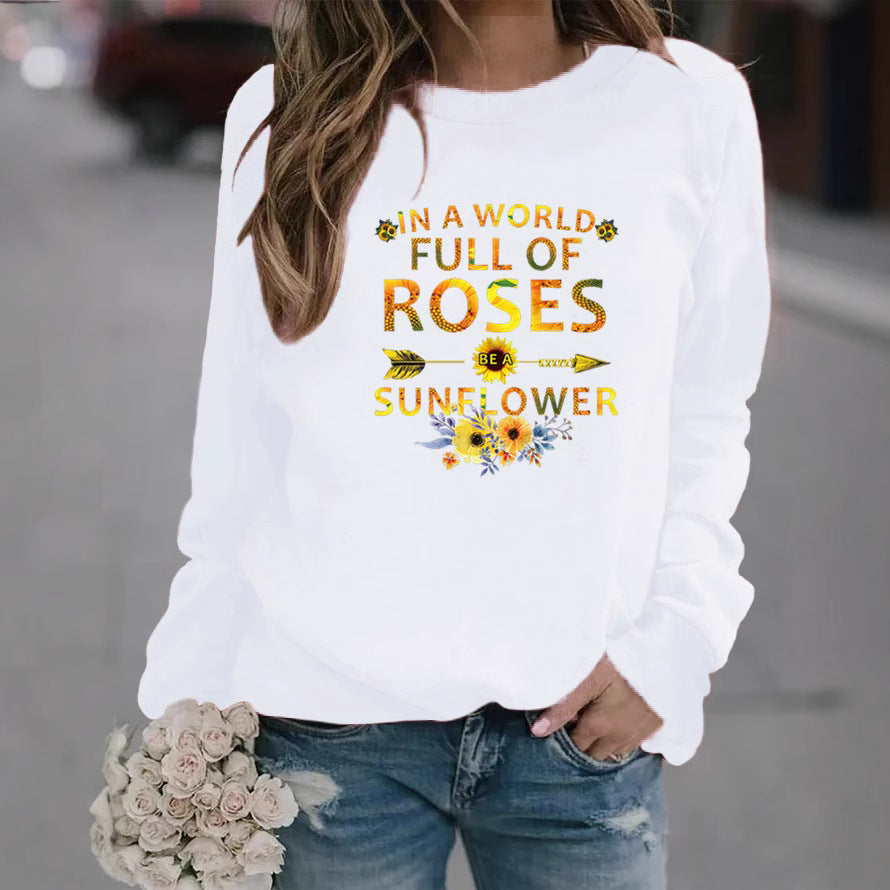 Kvinnors sweatshirt med inspirerande design och blommig dekorering Mirla-Eva Jonsson