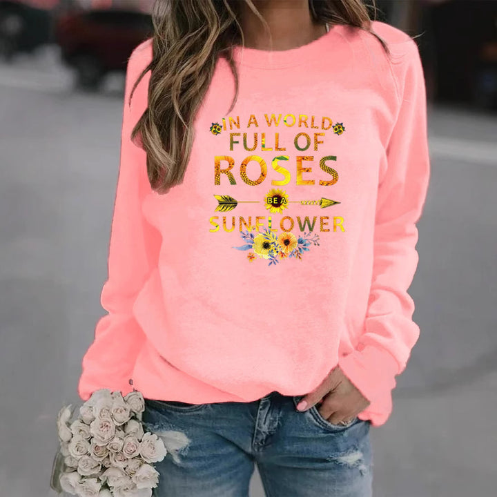 Kvinnors sweatshirt med inspirerande design och blommig dekorering Mirla-Eva Jonsson