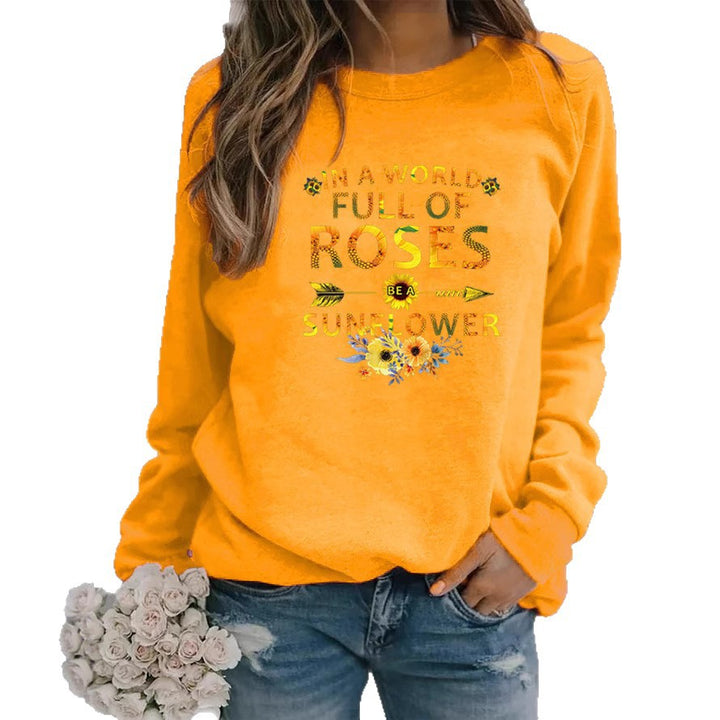 Kvinnors sweatshirt med inspirerande design och blommig dekorering Mirla-Eva Jonsson