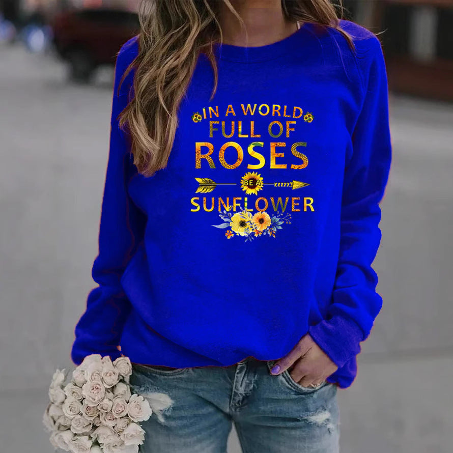 Kvinnors sweatshirt med inspirerande design och blommig dekorering Mirla-Eva Jonsson