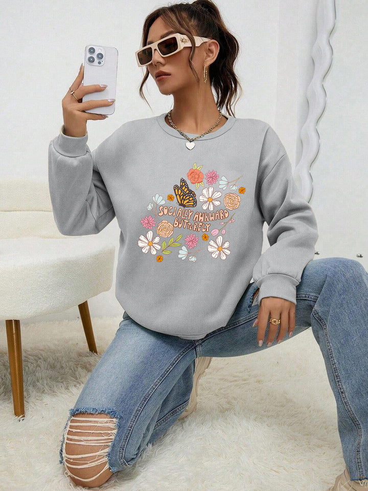 Kvinnors sweatshirt med kreativt blommönster och inspirerande tryck Mirla-Eva Jonsson