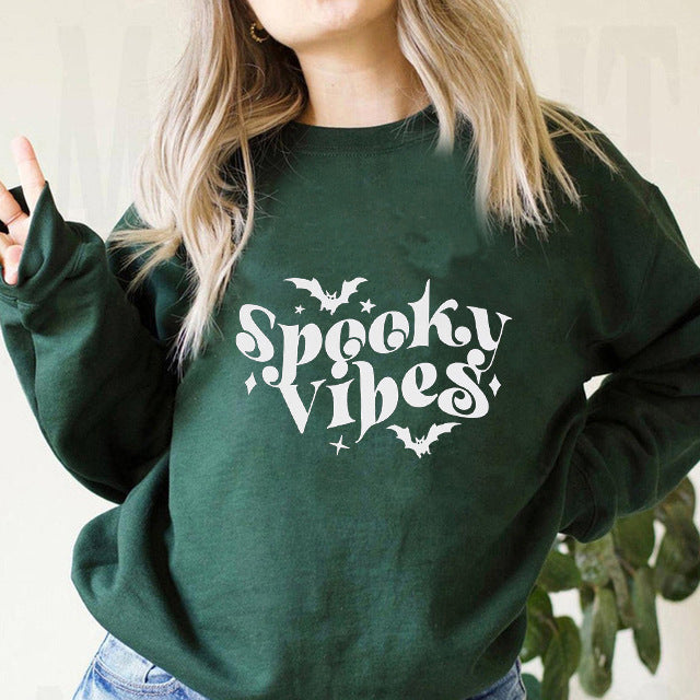 Kvinnors sweatshirt med lekfull Halloween-design och bekväm passform Mirla-Eva Jonsson