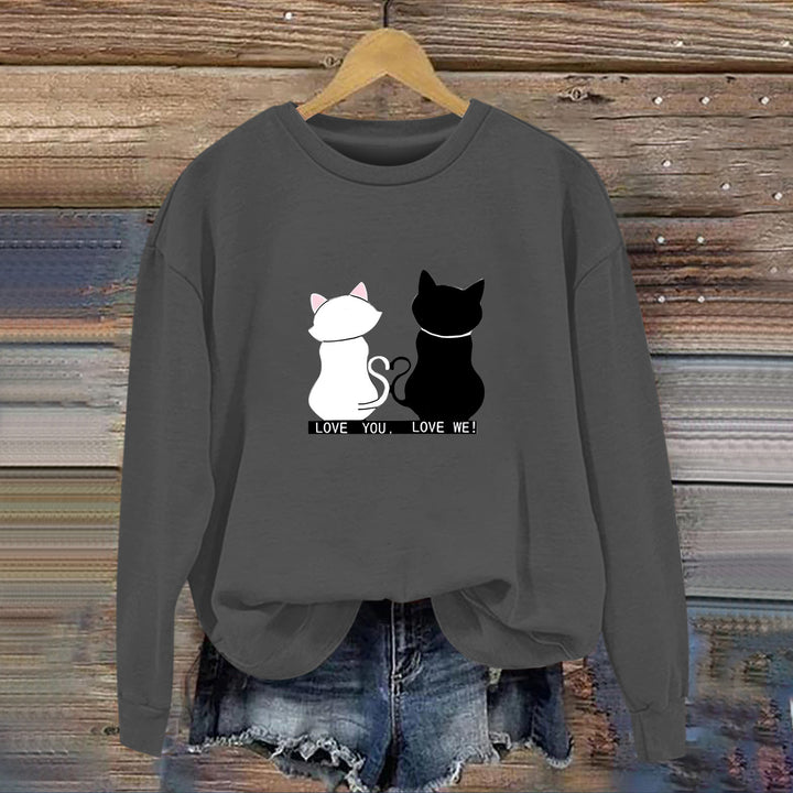 Kvinnors sweatshirt med lekfull kattdesign och humoristisktryck Mirla-Eva Jonsson
