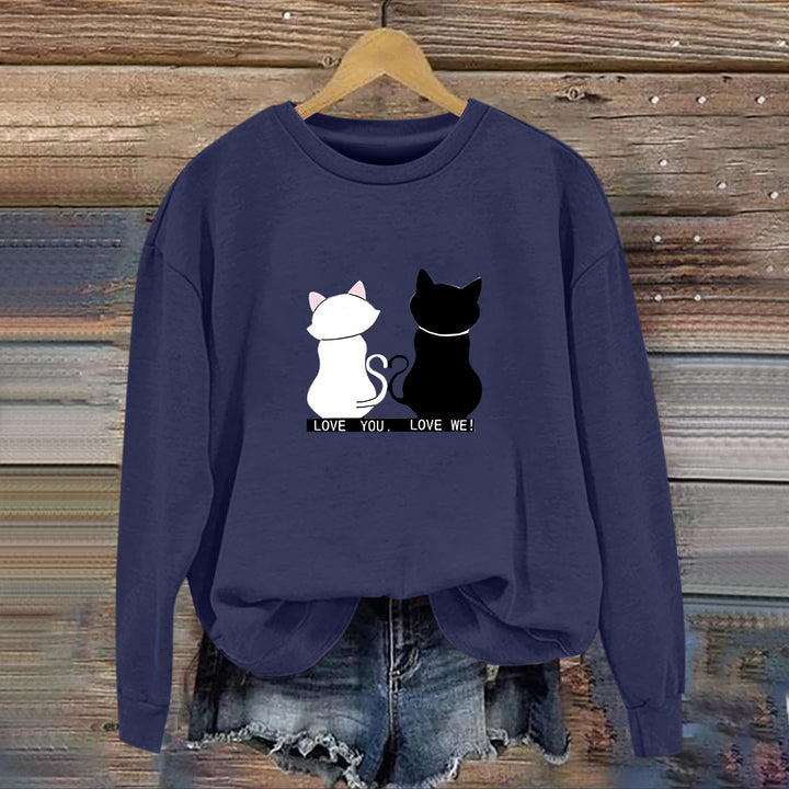 Kvinnors sweatshirt med lekfull kattdesign och humoristisktryck Mirla-Eva Jonsson