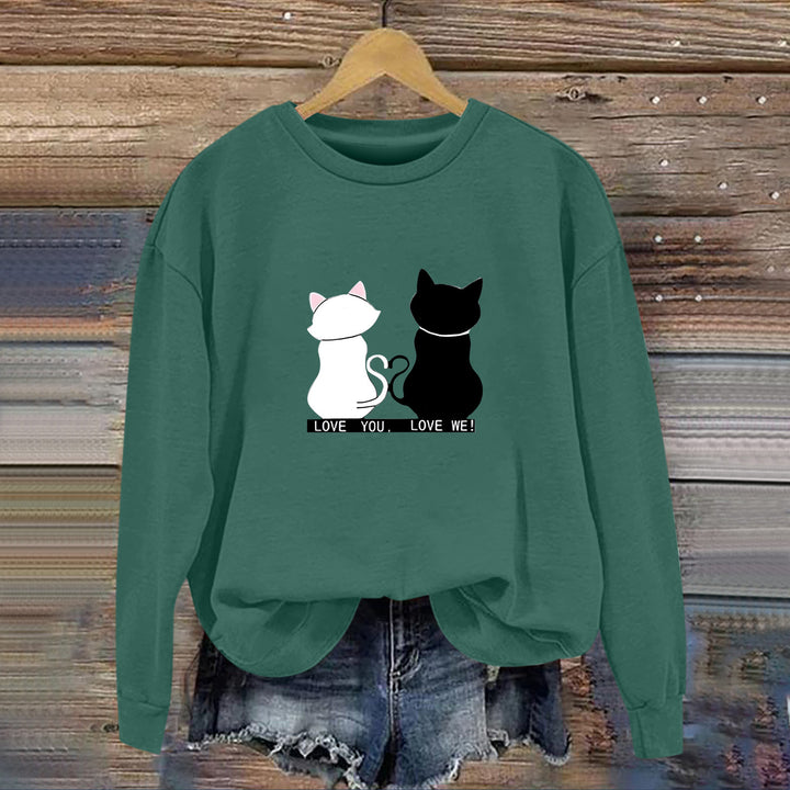 Kvinnors sweatshirt med lekfull kattdesign och humoristisktryck Mirla-Eva Jonsson