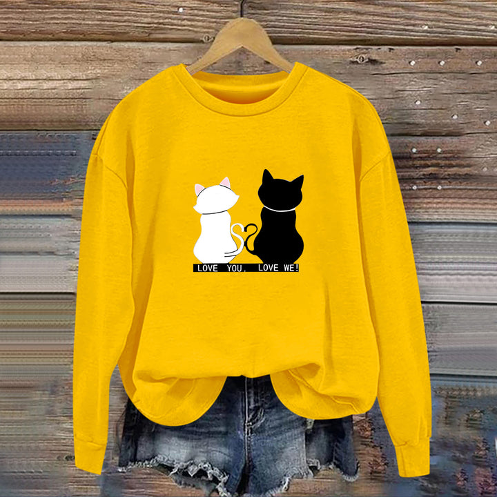 Kvinnors sweatshirt med lekfull kattdesign och humoristisktryck Mirla-Eva Jonsson