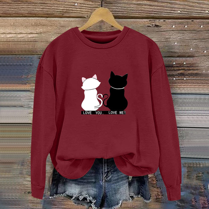 Kvinnors sweatshirt med lekfull kattdesign och humoristisktryck Mirla-Eva Jonsson