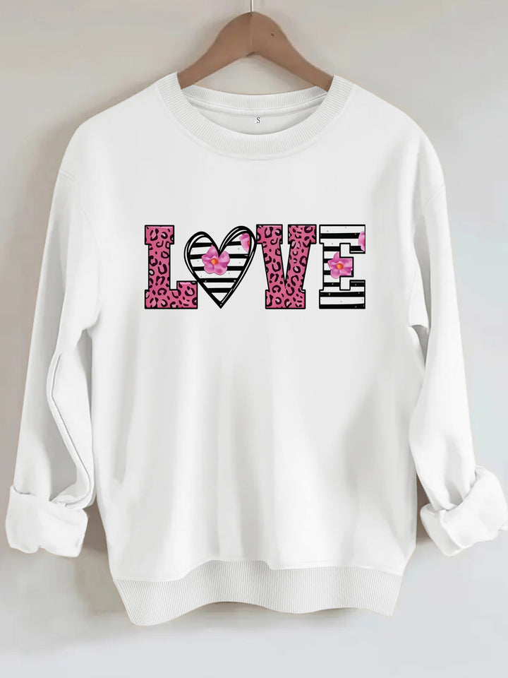 Kvinnors sweatshirt med modernt leopardhjärtadesign och bekväm passform Mirla-Eva Jonsson