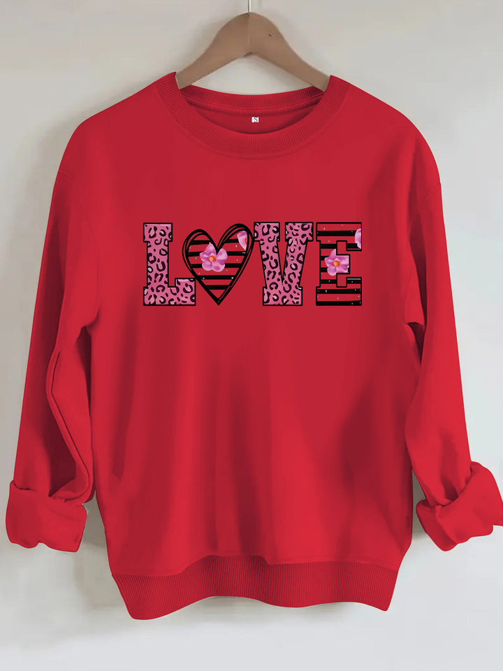 Kvinnors sweatshirt med modernt leopardhjärtadesign och bekväm passform Mirla-Eva Jonsson