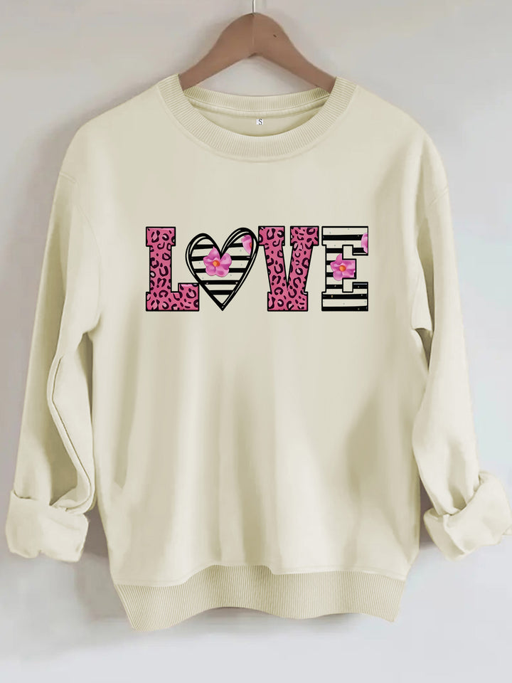 Kvinnors sweatshirt med modernt leopardhjärtadesign och bekväm passform Mirla-Eva Jonsson