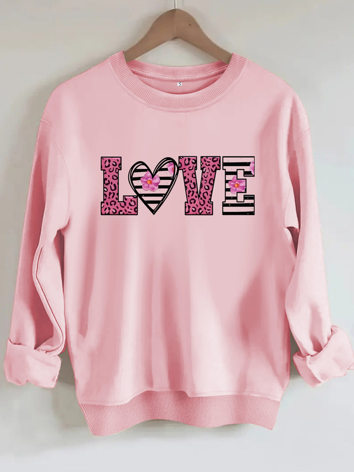 Kvinnors sweatshirt med modernt leopardhjärtadesign och bekväm passform Mirla-Eva Jonsson