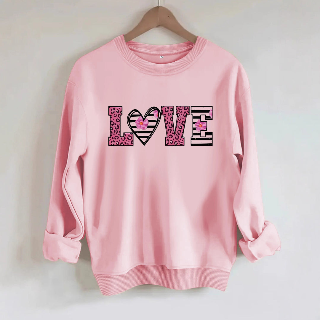 Kvinnors sweatshirt med modernt leopardhjärtadesign och bekväm passform Mirla-Eva Jonsson