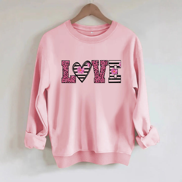 Kvinnors sweatshirt med modernt leopardhjärtadesign och bekväm passform Mirla-Eva Jonsson