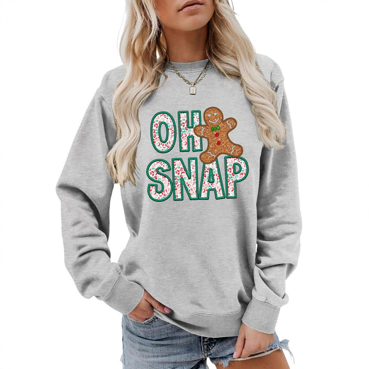 Kvinnors sweatshirt med roligt pepparkakeman motiv och glittrande bokstäver Mirla-Eva Jonsson