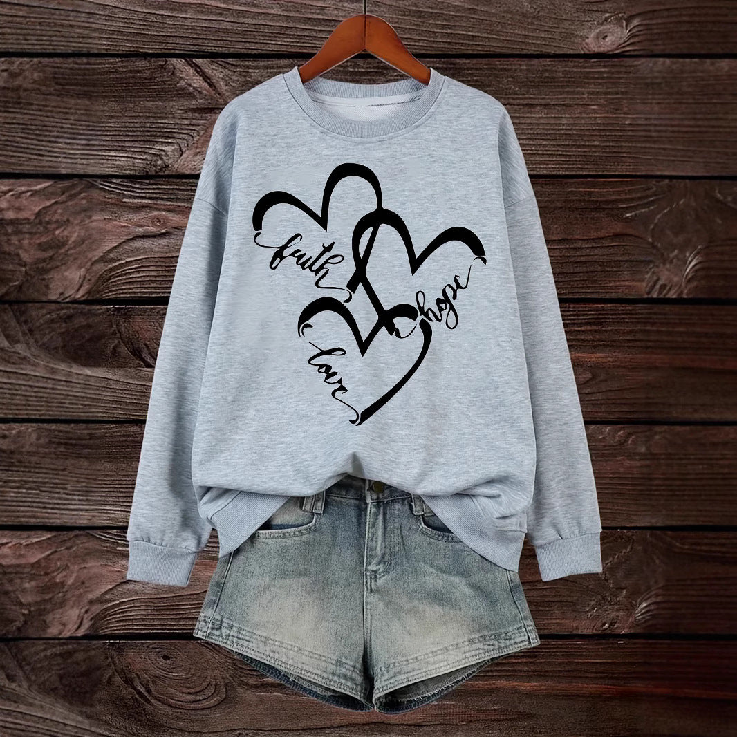 Kvinnors sweatshirt med romantiskt hjärtmotiv och inspirerande tryck Mirla-Eva Jonsson
