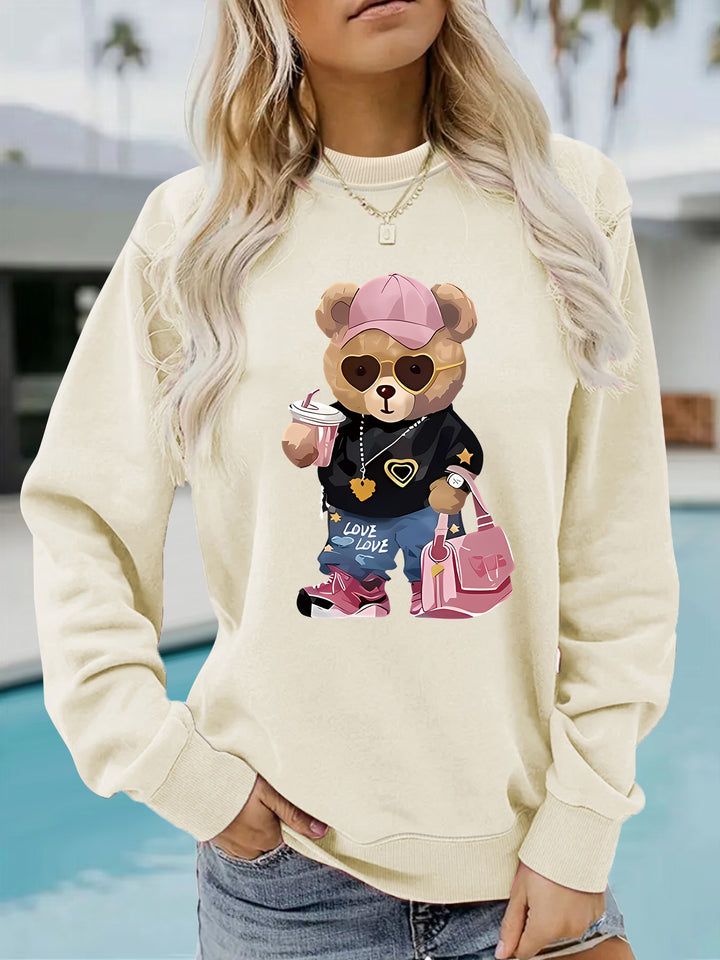 Kvinnors sweatshirt med unikt tecknad björn design och trendig text Mirla-Eva Jonsson