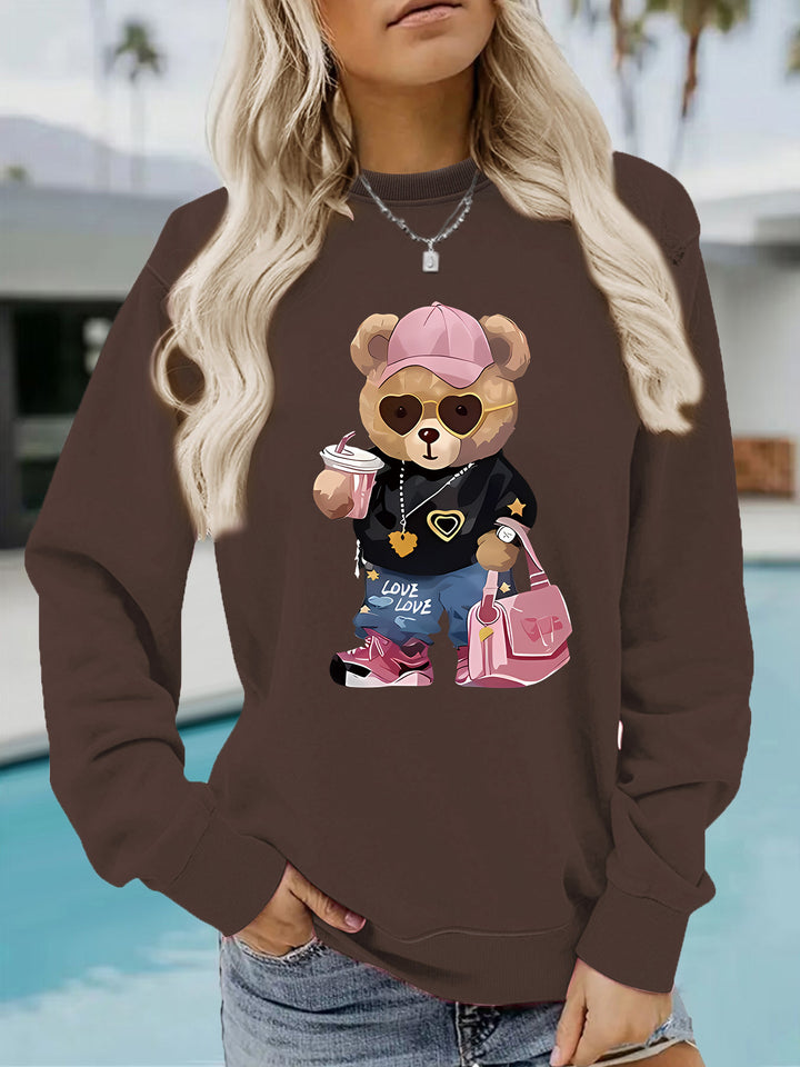 Kvinnors sweatshirt med unikt tecknad björn design och trendig text Mirla-Eva Jonsson