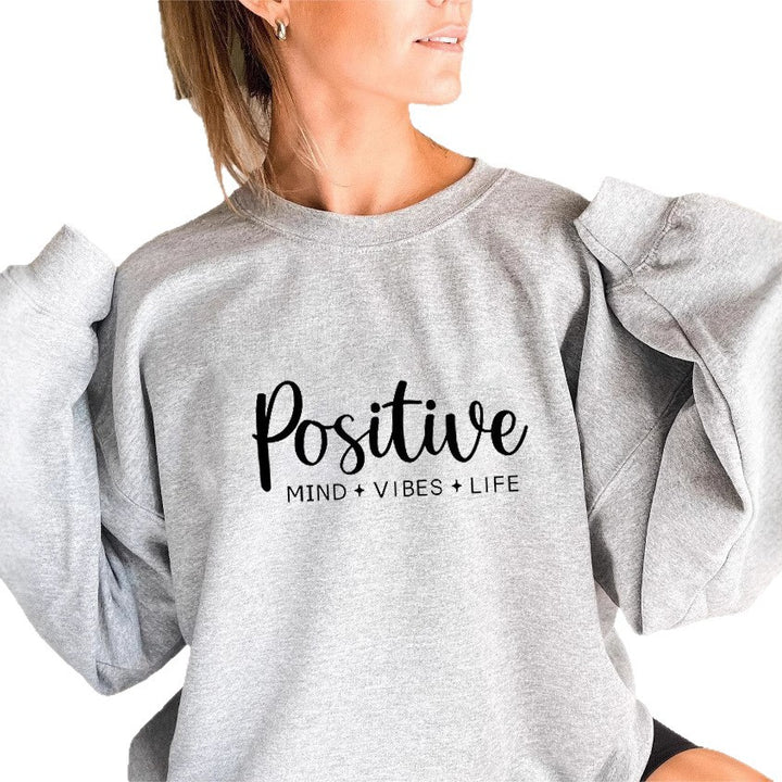 Kvinnors sweatshirt med voluminösa ärmar och inspirerande tryck Mirla-Eva Jonsson