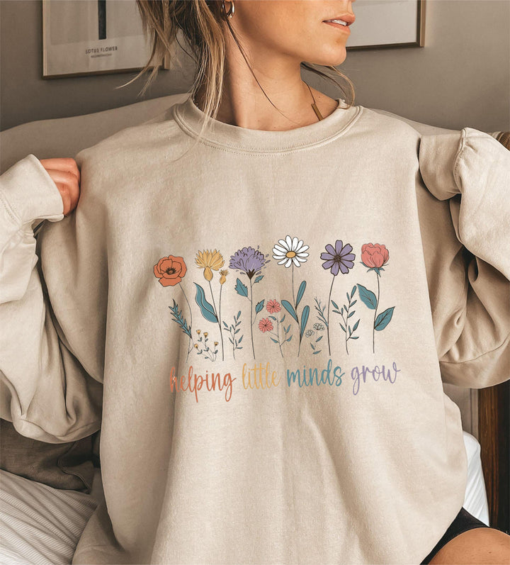 Kvinnors sweatshirt med voluminösa ärmar och motiverande blommönster Mirla-Eva Jonsson
