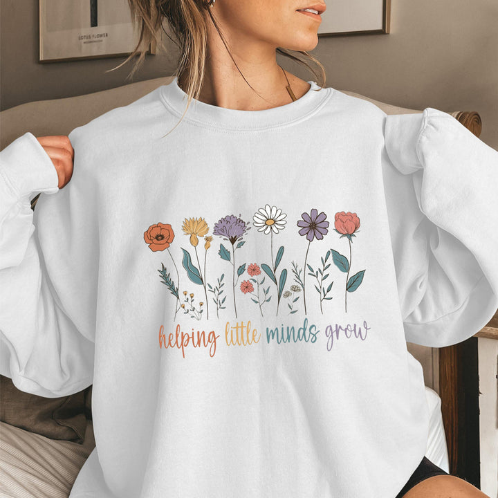Kvinnors sweatshirt med voluminösa ärmar och motiverande blommönster Mirla-Eva Jonsson