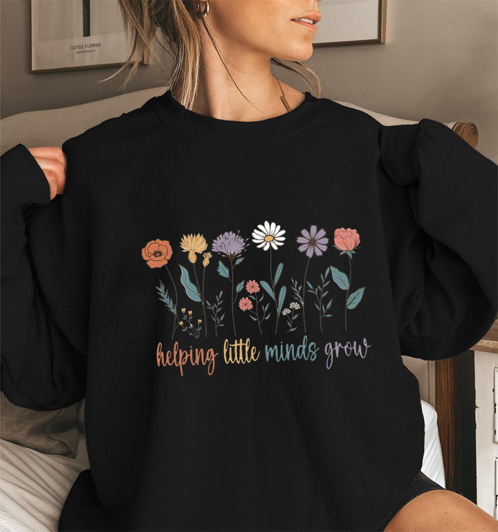 Kvinnors sweatshirt med voluminösa ärmar och motiverande blommönster Mirla-Eva Jonsson