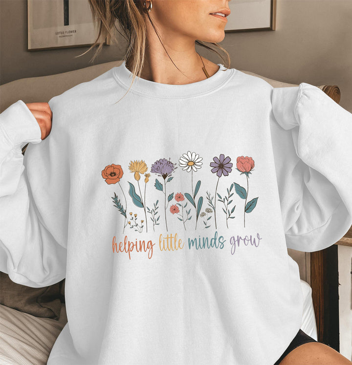 Kvinnors sweatshirt med voluminösa ärmar och motiverande blommönster Mirla-Eva Jonsson