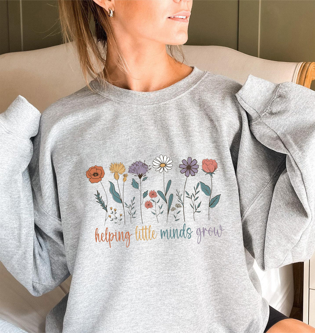 Kvinnors sweatshirt med voluminösa ärmar och motiverande blommönster Mirla-Eva Jonsson