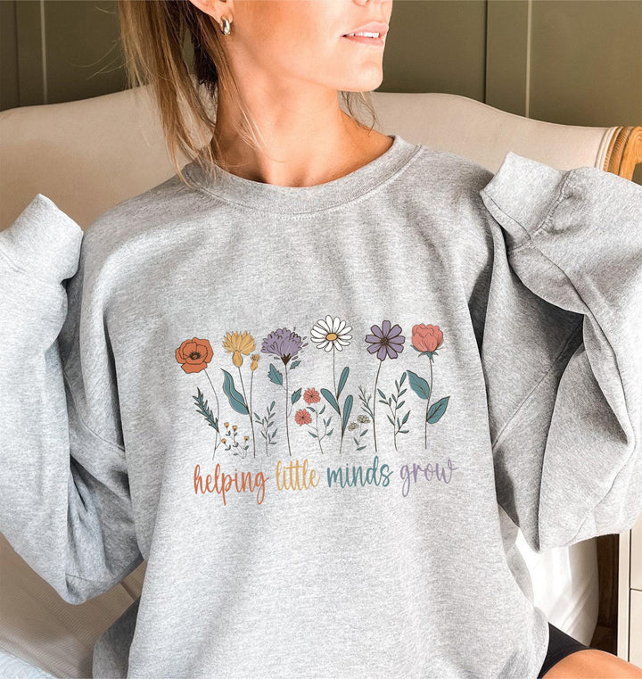 Kvinnors sweatshirt med voluminösa ärmar och motiverande blommönster Mirla-Eva Jonsson