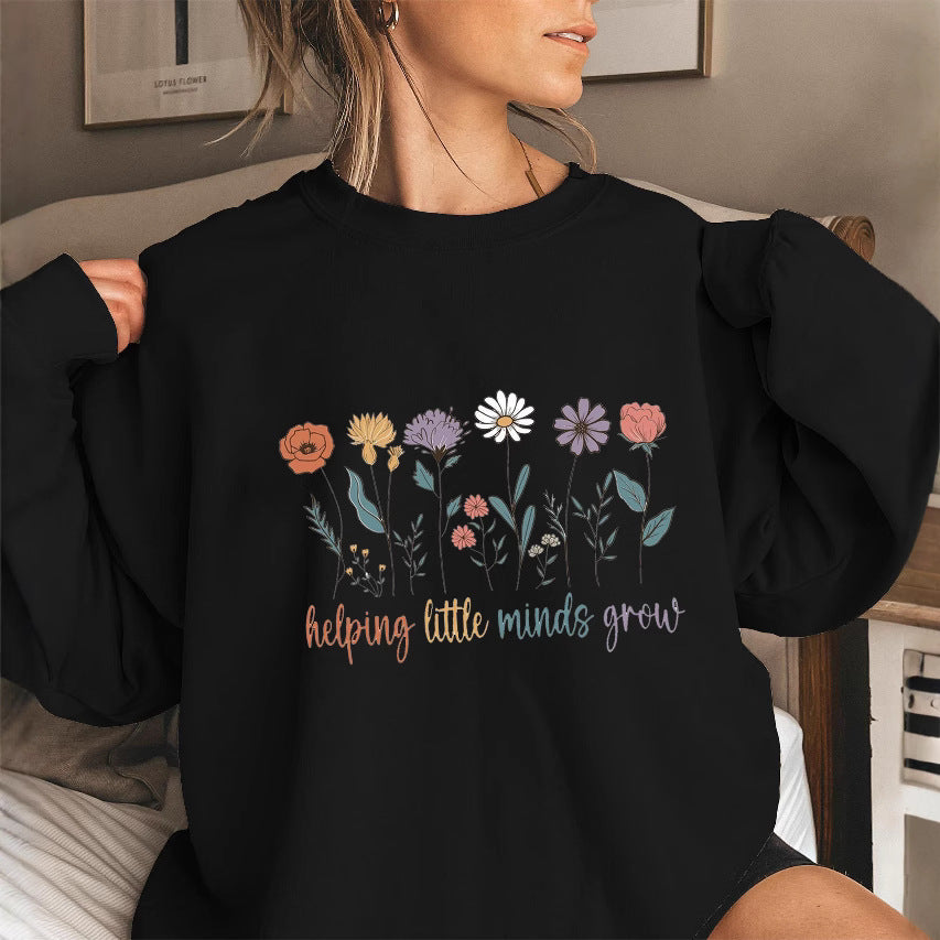 Kvinnors sweatshirt med voluminösa ärmar och motiverande blommönster Mirla-Eva Jonsson