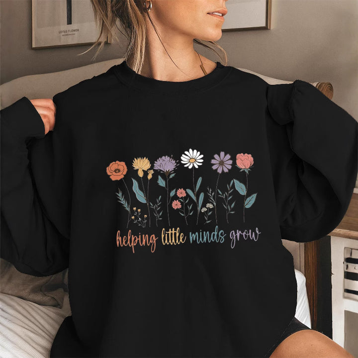 Kvinnors sweatshirt med voluminösa ärmar och motiverande blommönster Mirla-Eva Jonsson