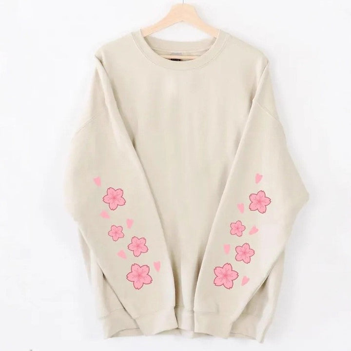 Kvinnors sweatshirts med blommönster och generösa ärmar Mirla-Eva Jonsson