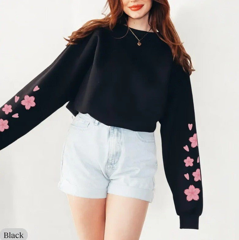 Kvinnors sweatshirts med blommönster och generösa ärmar Mirla-Eva Jonsson