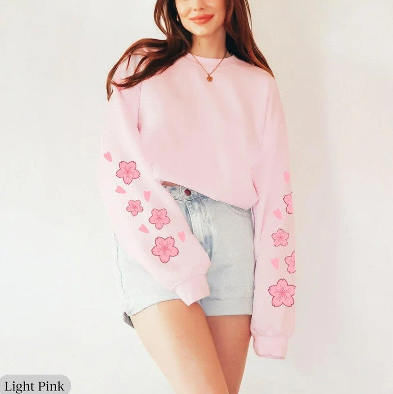 Kvinnors sweatshirts med blommönster och generösa ärmar Mirla-Eva Jonsson