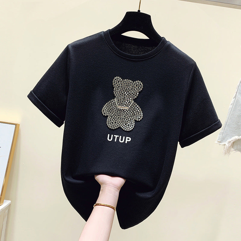 Kvinnors t-shirt med glittrande björnmotiv och avslappnad passform Mirla-Eva Jonsson