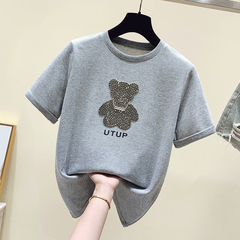 Kvinnors t-shirt med glittrande björnmotiv och avslappnad passform Mirla-Eva Jonsson