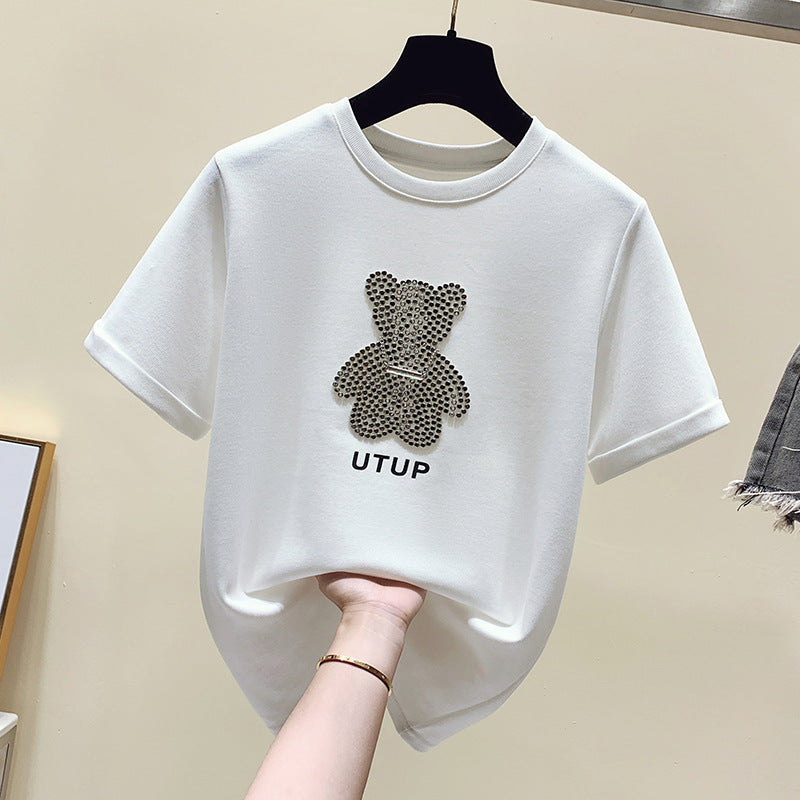 Kvinnors t-shirt med glittrande björnmotiv och avslappnad passform Mirla-Eva Jonsson