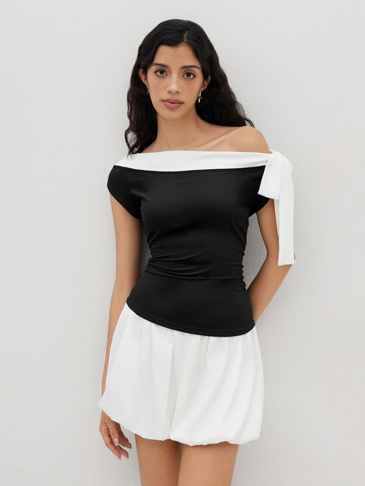 Kvinnors topp med off-shoulder design och lekfull knytning stängning Mirla-Eva Jonsson