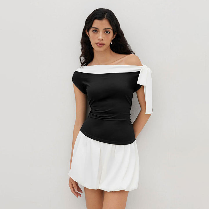 Kvinnors topp med off-shoulder design och lekfull knytning stängning Mirla-Eva Jonsson