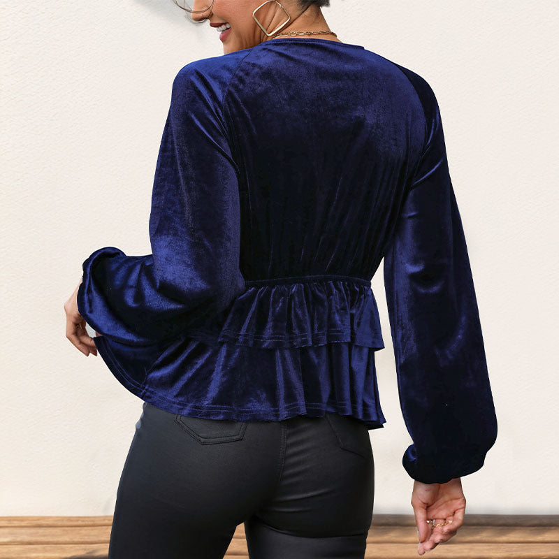 Kvinnors topp med voluminös peplum och djup V-hals Mirla-Eva Jonsson