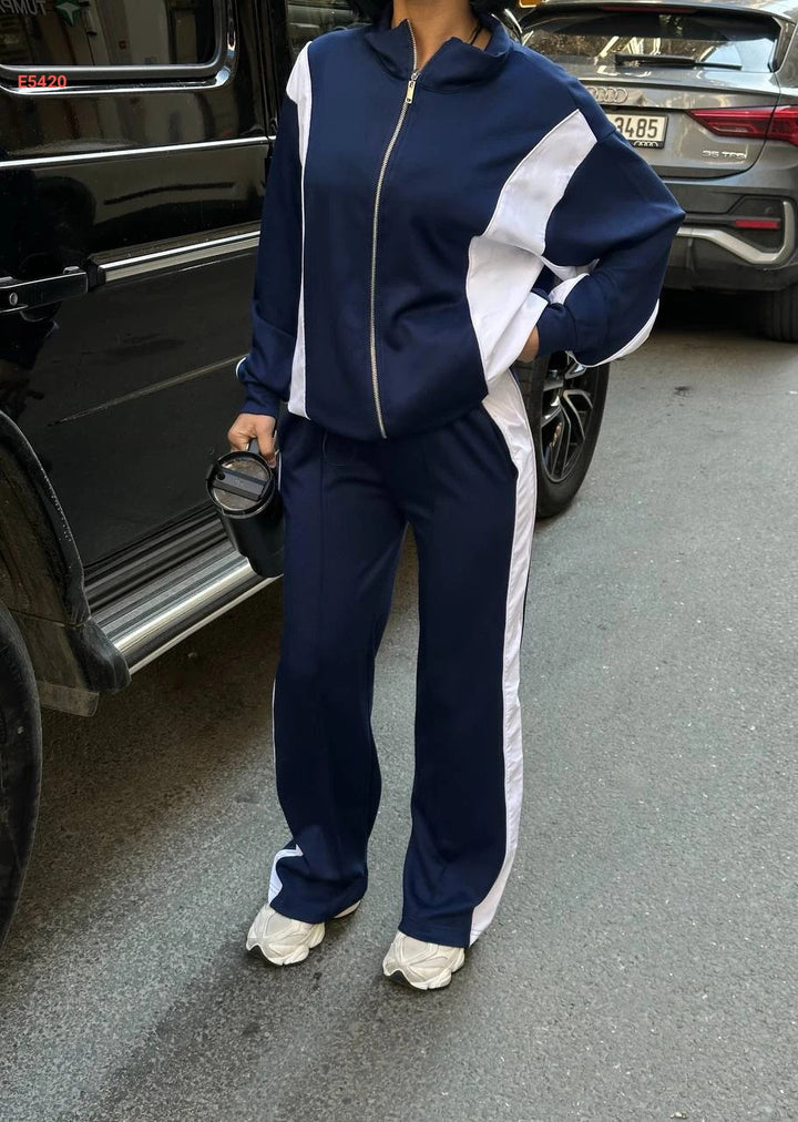 Kvinnors träningsdräkt med hög krage och praktiska dragkedjor-Eva Jonsson